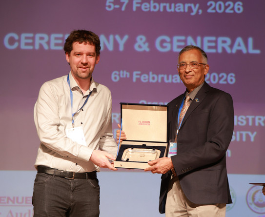 Prof. Max Hansmann receives the award certificate from the president of the Chemical Research Society of India.