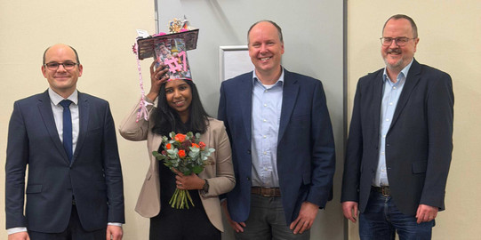PhD defense of Malavika. From left to right: David Van Craen (supervisor and 1st examiner), Malavika G. Kalarikkal, Guido Clever (2nd examiner) and Stefan Kast (chairman of the defense)