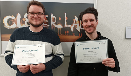 Picture of Alexandre Walther and Elie Benchimol with their poster price certificates of the SupraChem 2024